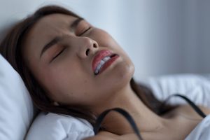 why you're grinding your teeth at night